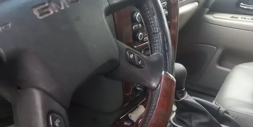 Where on a 2003 gmc envoy is the obd port